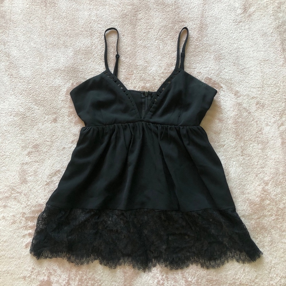 Cut out deep cut blouse with lace details